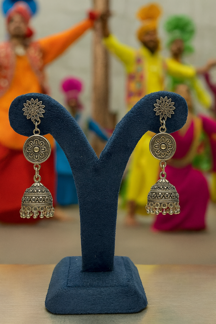 traditional jhumka-style earrings.