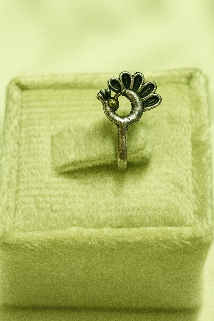 peacock-inspired oxidized silver nose pin,